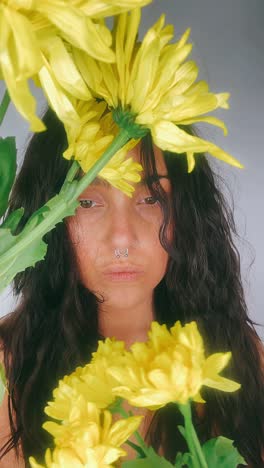 woman surrounded by yellow flowers