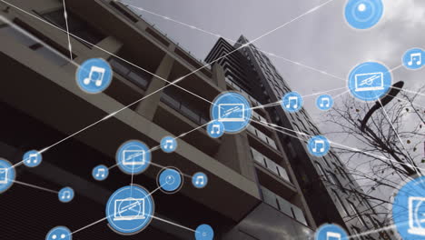 music and media icons connected by lines animation over modern building exterior