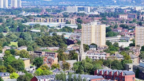 houses and apartments in northern london, telephoto, aerial rising