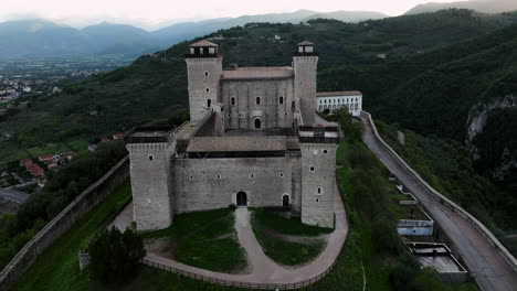 fly over castle rocca albornoziana in spoleto valley during sunrise in umbria, italy