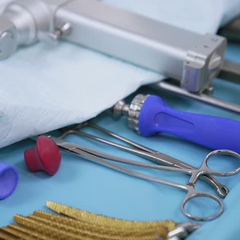set of medical tools on surgical table. detailed instruments in the operating room. close-up. health care concept