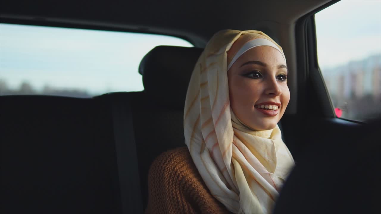 Woman in Hijab in a Car