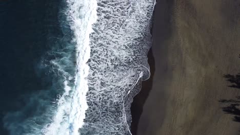 beach of black sands in reunion island