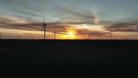 sunsetting over a windfarm in portland, texas