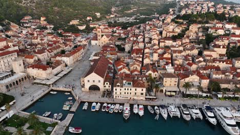 drone view of the harbor and city center of hvar in croatia.