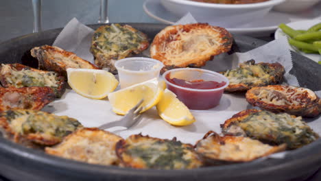 a dozen grilled oysters on the half shell, oysters rockefeller, slider hd