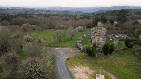 aerial dolly to entrance of church of santa maria de salamonde in san amaro spain