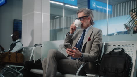 businessman waiting at airport lounge