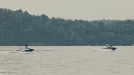 motorboats cruising in the lake at sunrise