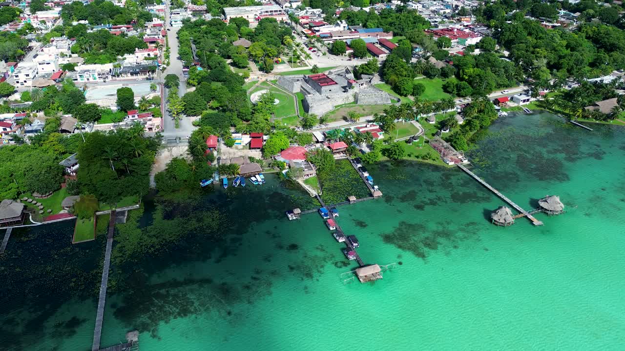 Aerial View of a Town on a Turquoise Lake in Mexico