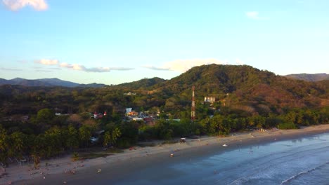 Aerial-over-Samara-Beach-and-town-in-the-Guanacaste-Province,-Costa-Rica