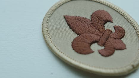 close up pan right of an angled boy scout arm patch