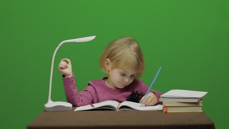 Girl-drawing-at-the-table.-Education-process-in-classroom.-Chroma-Key