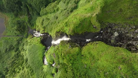 above poço ribeira do ferreiro waterfall at flores island azores, aerial