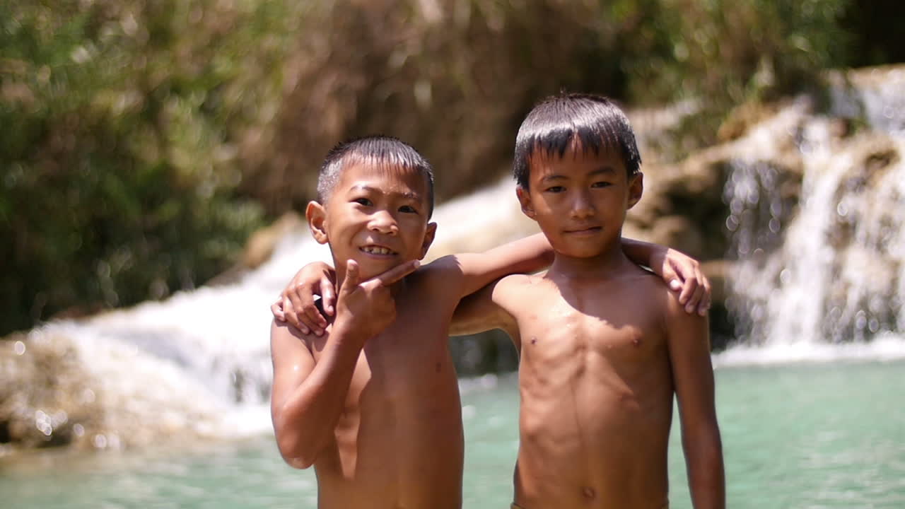 Two Boys at a Waterfall