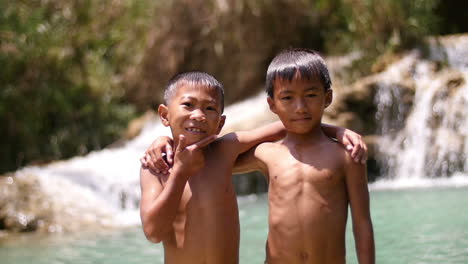 two boys at a waterfall