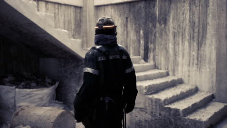 worker in protective gear surveying an industrial site during daytime