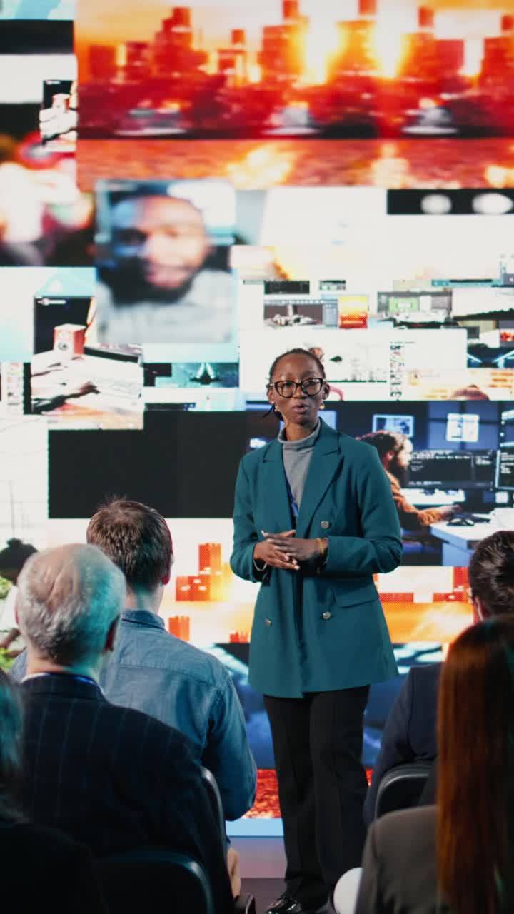 Vertical Video Black woman leads dynamic social media presentation during corporate event