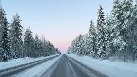 driving a winter road with no cars between