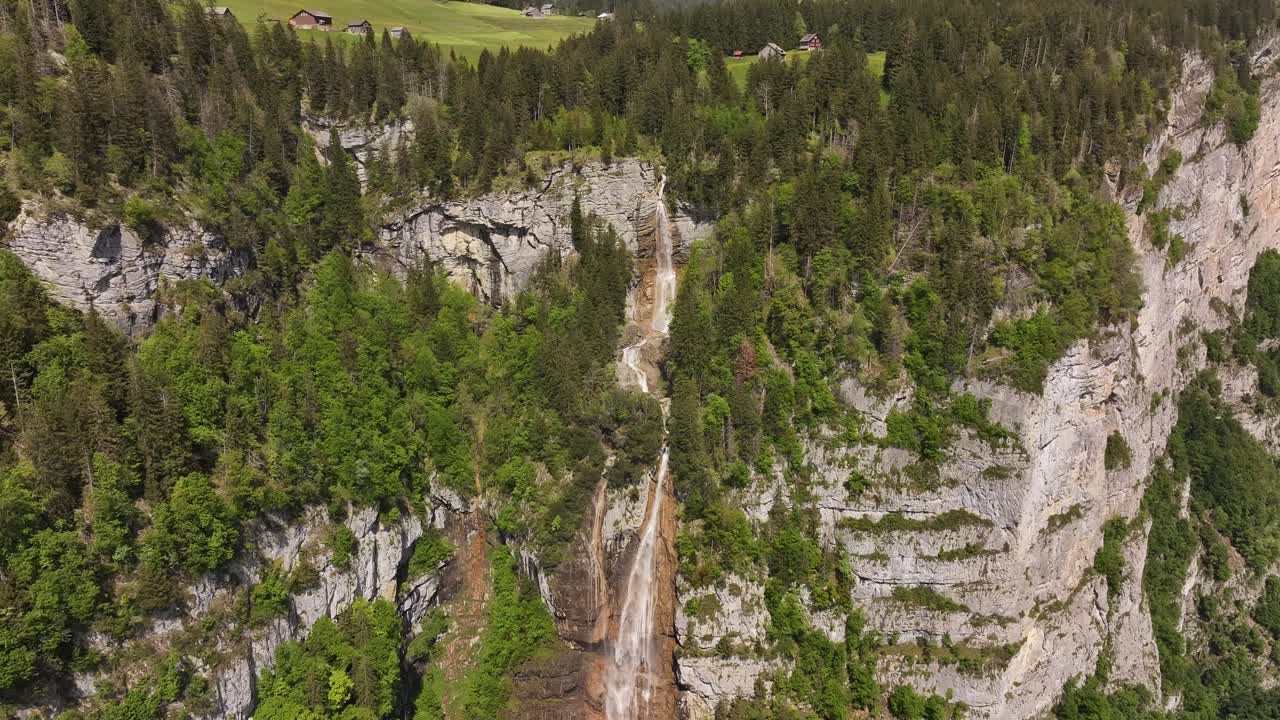 Seerenbach Falls cascading over the cliffs in Amden, Betlis near Lake Walensee