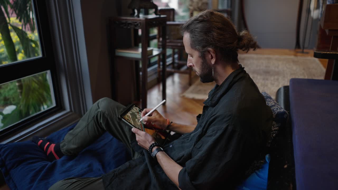 A man creating digital art on a tablet