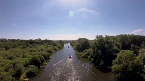 aerial drone footage of a boat along the river waveney, norfolk