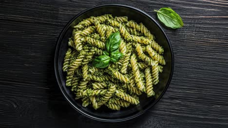 delicious plate of pasta al pesto with fresh basil garnish