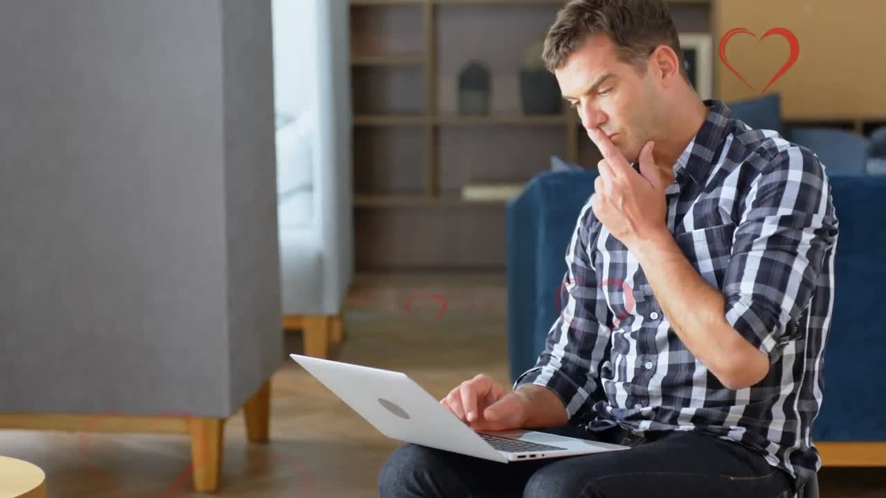 animación de corazones cayendo sobre los hombres usando computadora portátil