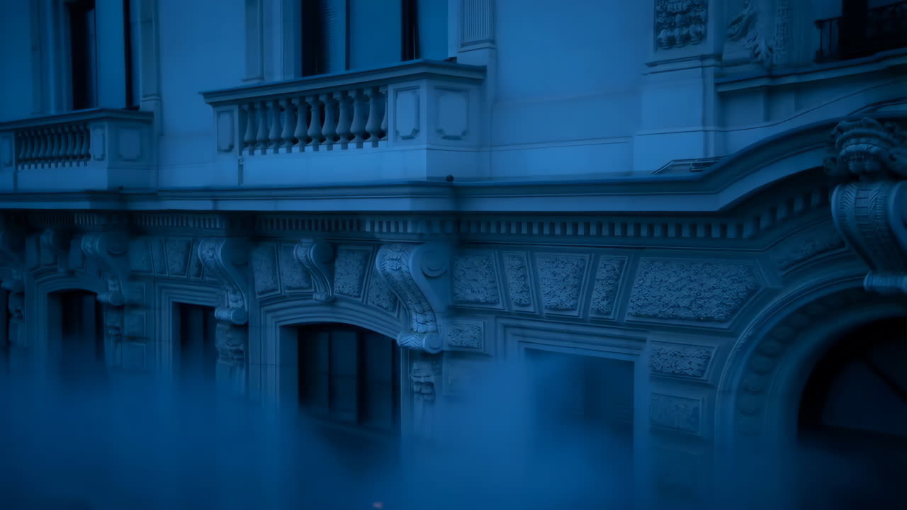 Blue-toned building facade at night