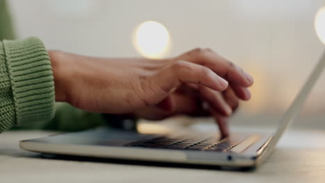 Hands-of-person,-laptop-keyboard