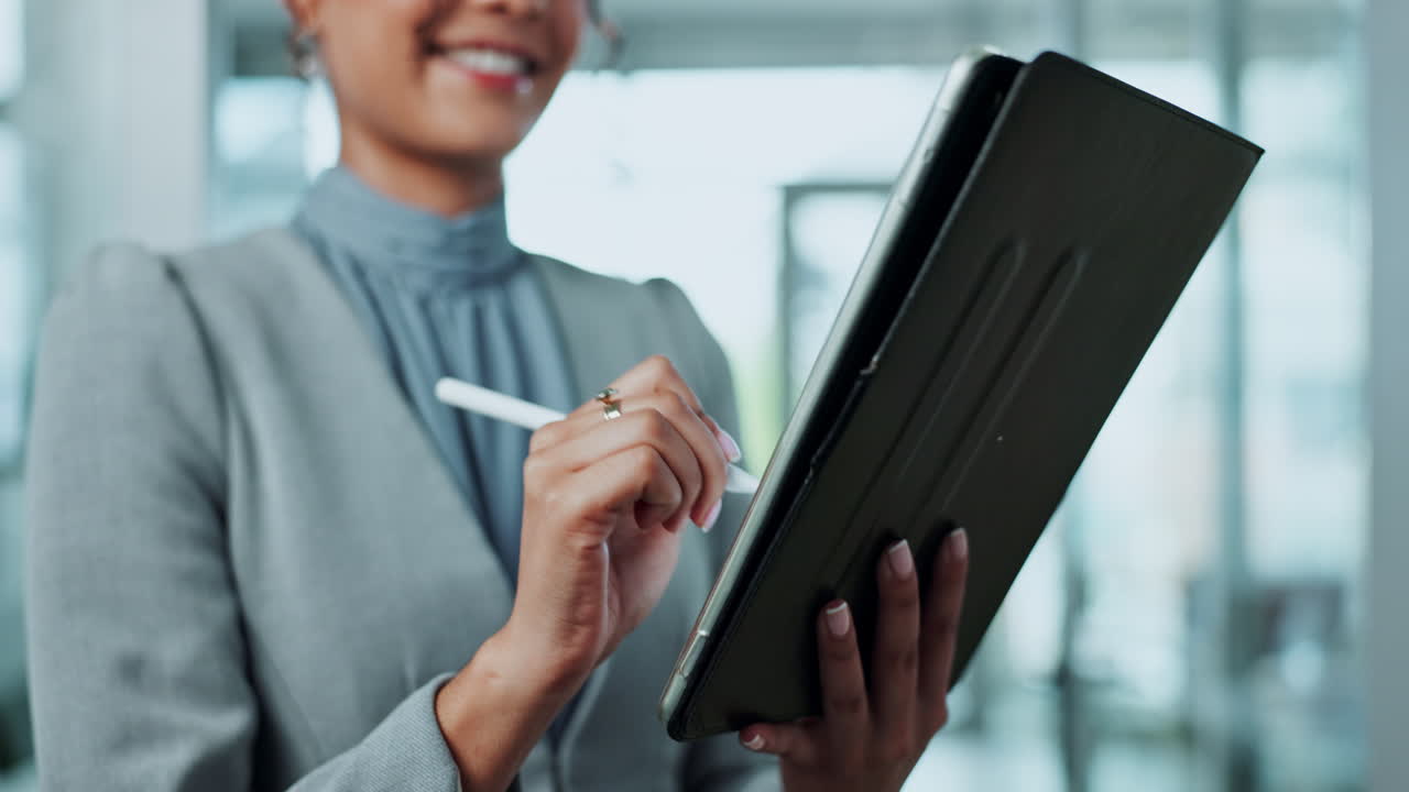 Woman using a tablet with a stylus in an office setting