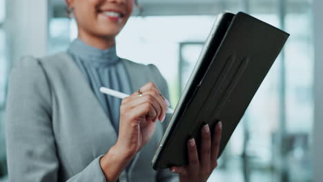 woman using a tablet with a stylus in an office setting