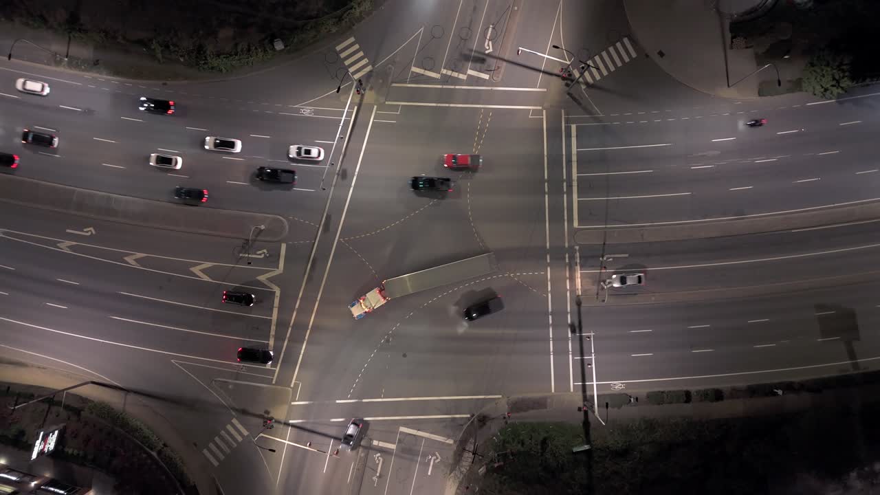 Top Down Aerial View Cars Driving at Intersection at Night - Vertical