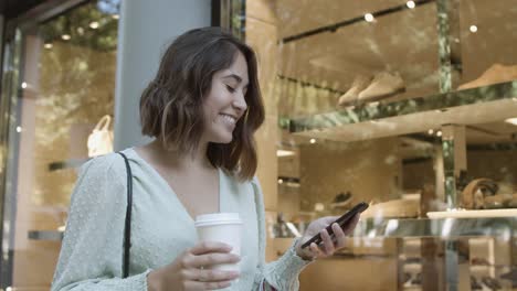 Pretty-Latin-woman-typing-on-smartphone,-reading-chat