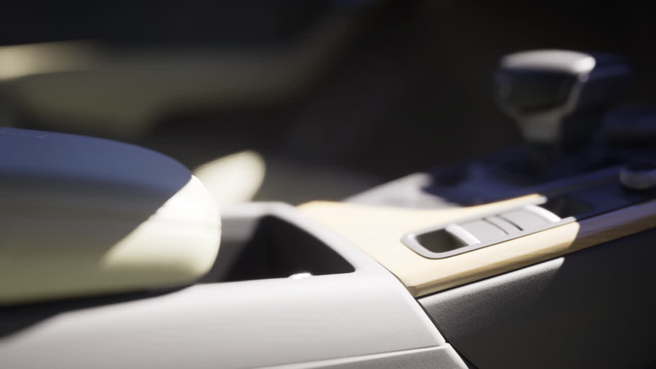 Details of a car interior highlighting the console and gear shifter