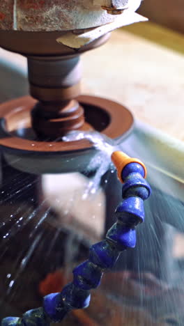 grinder cutting marble. detail of a circular saw used to cut granite vertical video