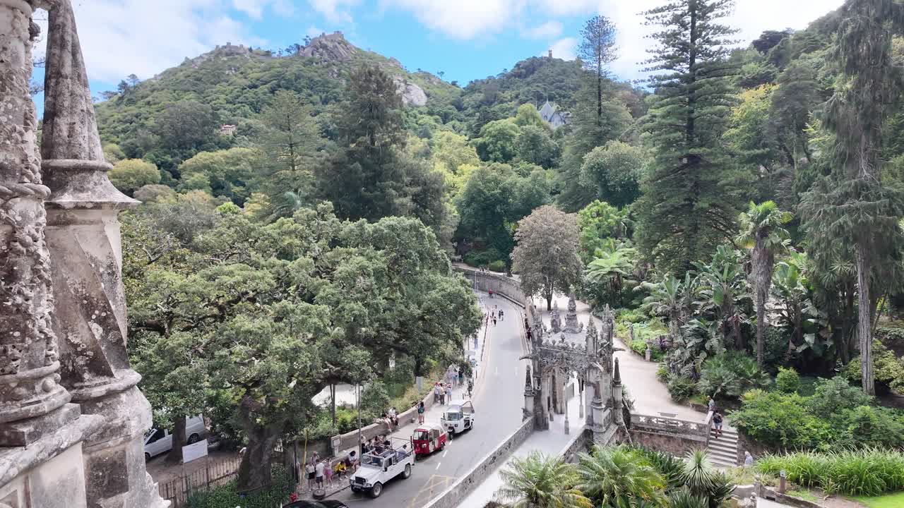 Ornate facade of Quinta da Regaleira in Sintra, Portugal with intricate details and lush greenery