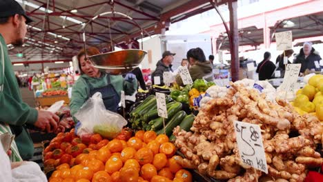 people purchasing fruits and vegetables at market