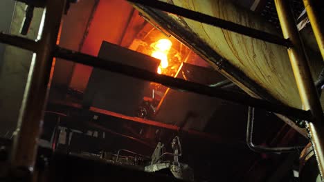 Burning-blanks-of-glass-bottles-in-an-industrial-stove-in-Glassworks