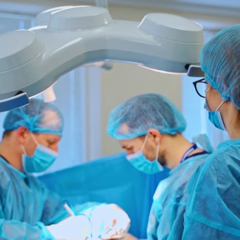 close up of surgery team operating
