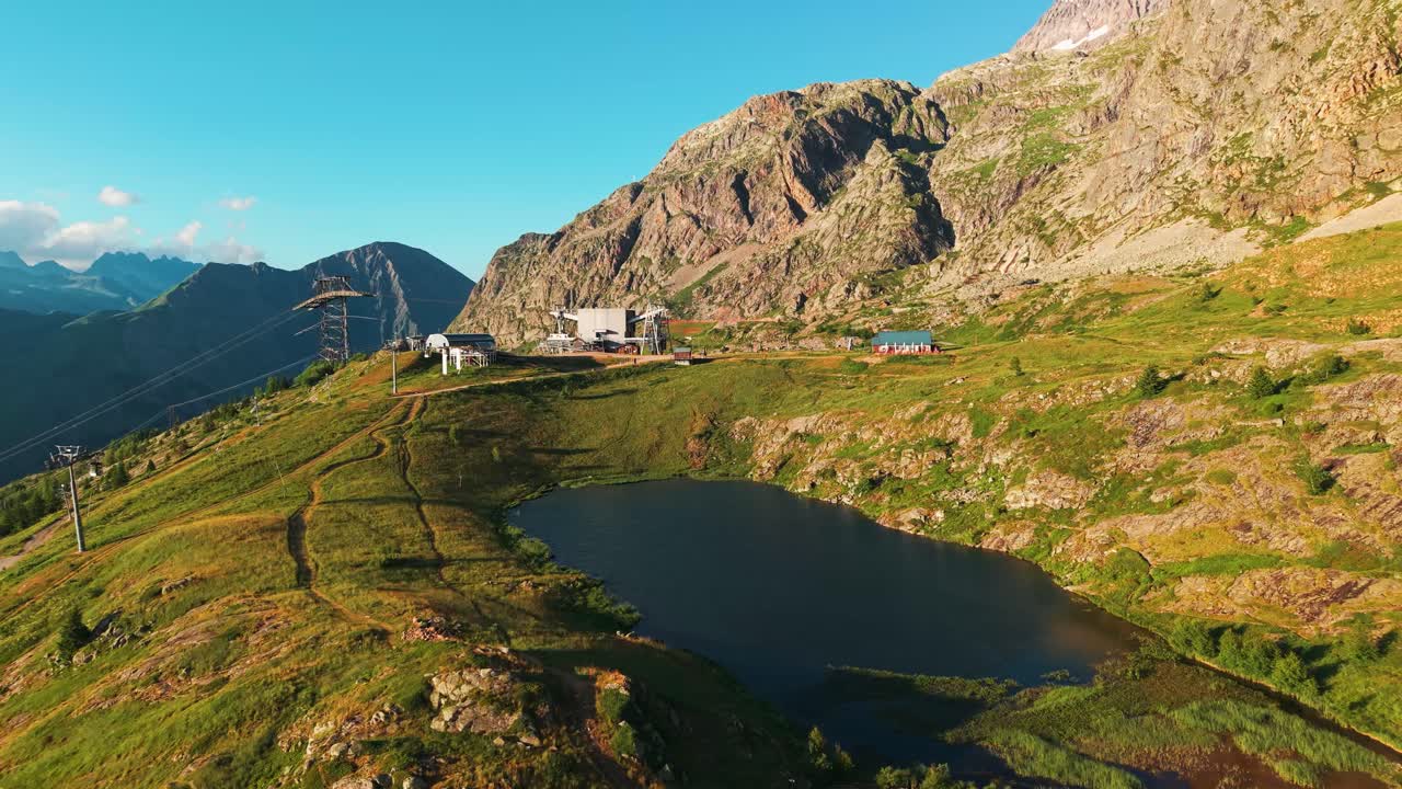 aerial shot around Lac Carrelet near l'Alpe d'Huez in the french Alps during summmer, isere departement, auvergne rhone alpes tourisme, france