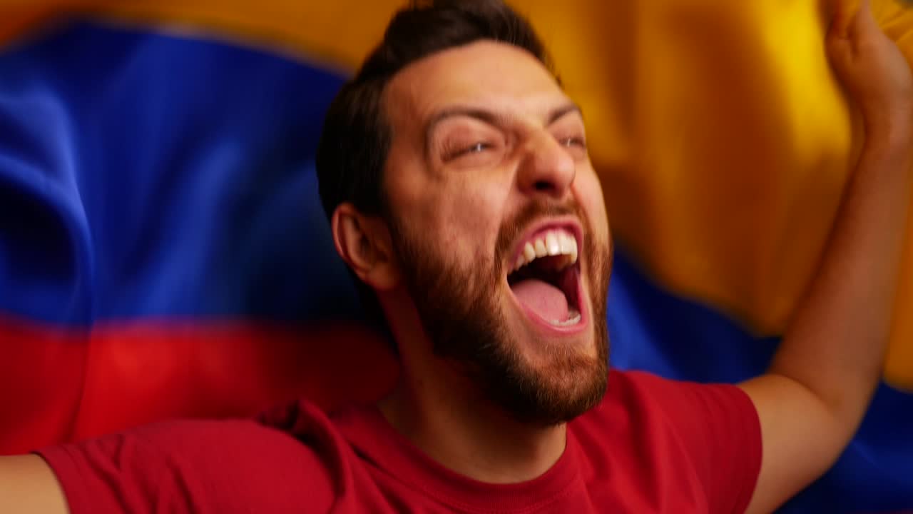 Colombian Fan Celebrating with Colombia Flag