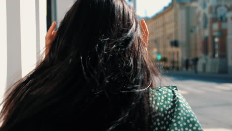 woman walking down a city street