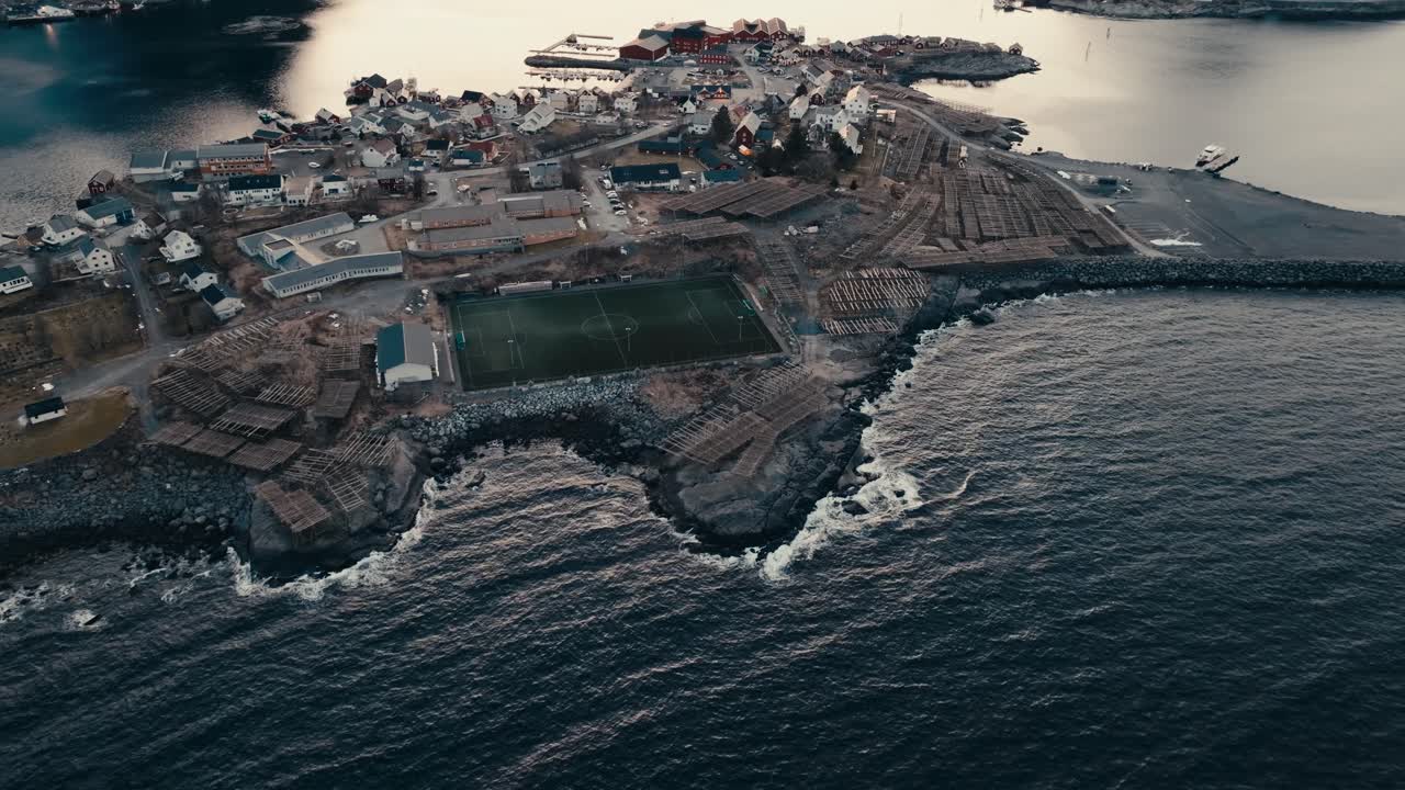 Reine Fishing Village, Soccer Field, And Hjeller Til Torrfisk In Nordland, Norway. - aerial shot