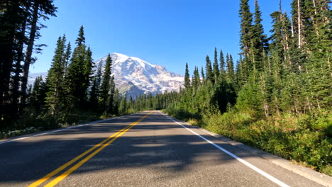 The-breathtaking-approach-to-Mount-Rainier,-showing-the-first-moment-when-the-mountain-reveals-itself-in-the-Paradise-part-of-the-National-Park