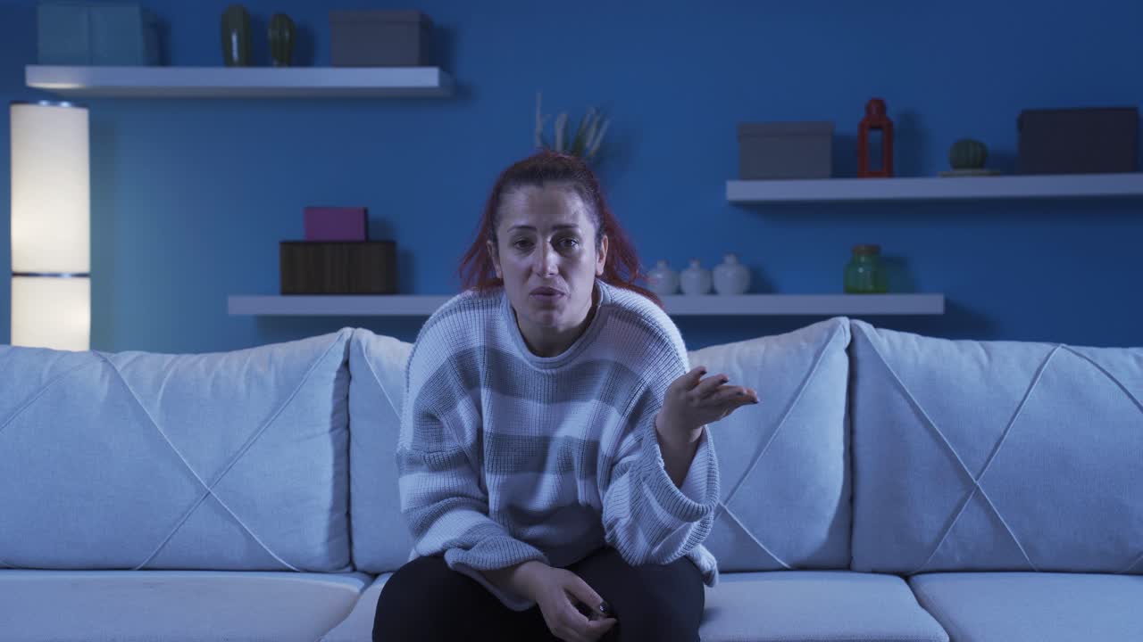Woman looking at camera with trouble.