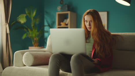 woman using laptop on her lap