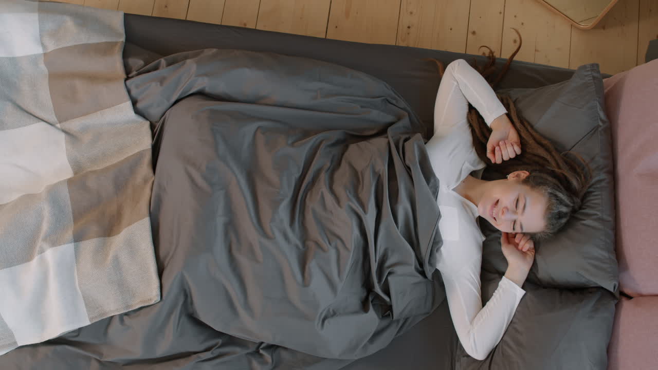 Sleepy Woman Lying In Bed Lazily