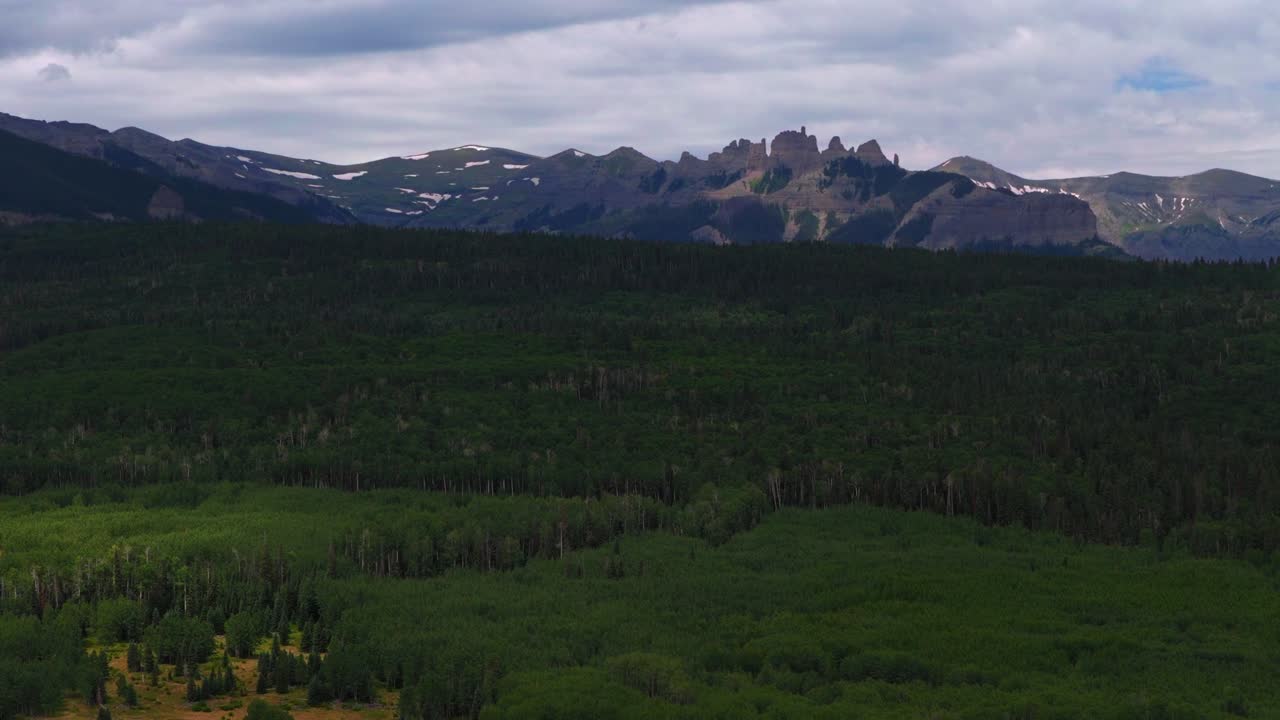 Mill Castle rock formation hidden gem Ohio Pass aerial drone Colorado Rocky Mountains spring summer morning cloudy Aspen Tree Forest groves Swampy Kebler Pass Gunnison National Forest forward pan up