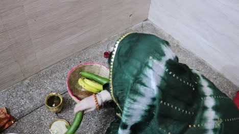 indian women doing holy rituals at home for children's wellbeing from different angle on the occasion of jitiya vrat or nirjala vrat in india